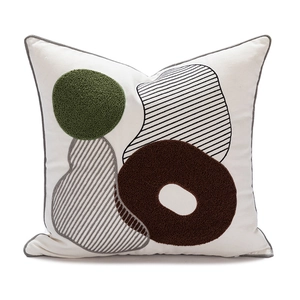 Modern white square pillow with green and brown abstract geometric towel embroidery details