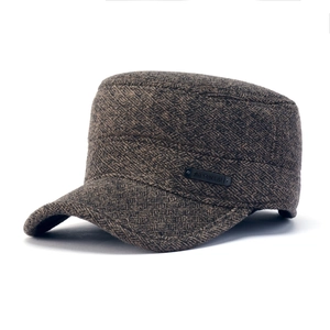 Brown wool cadet cap with thick twill texture and metal side badge on white background