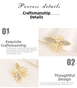 Macro detail of gold-plated copper bee pendant with shimmering inlaid zircons