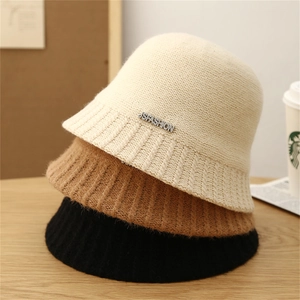 Three-pack knitted striped bucket hats in beige, camel, and black with fashion metal tag