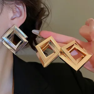 Exaggerated geometric double rhombus metal earrings in gold and silver finish