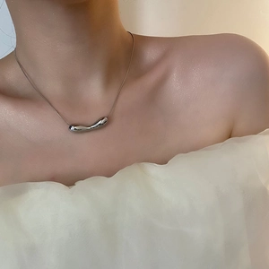 Polished silver irregular drop pendant on sleek snake chain necklace for women