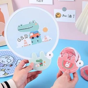 Close-up of portable folding fans with cute animal designs and compact storage case