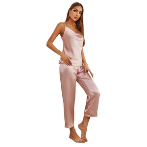 Elegant pink silk satin sleepwear set featuring camisole top and straight trousers