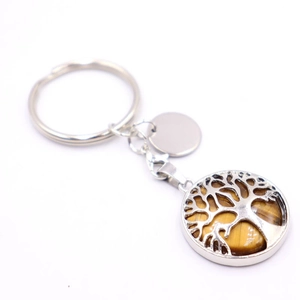Detail of tree of life keychain with tiger eye stone and silver blank metal tag