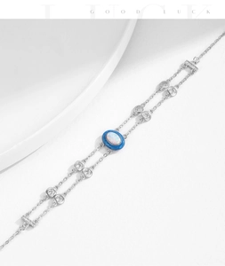 Detailed macro view of silver double-layer bracelet with blue opal stone and zircon
