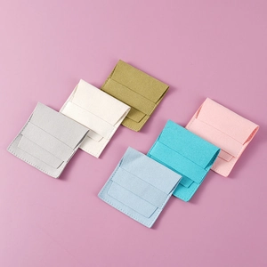 Microfiber jewelry pouches in six assorted colors including grey, yellow, and blue