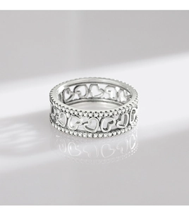 Detailed shot of S925 sterling silver hollow heart ring with small inlaid crystals