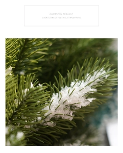 Detailed macro shot of artificial green pine branches with realistic white faux snow