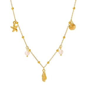Gold plated ocean style necklace with starfish, shells and pearls on a white background