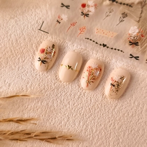 3D gold bronzing nail stickers with floral butterfly and heart patterns on nails