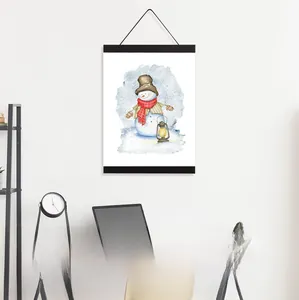 Detail of black magnetic wooden hanger frame holding a snowman poster on a white wall