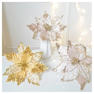 Macro detail of champagne gold glitter poinsettia flower in a ceramic vase decor
