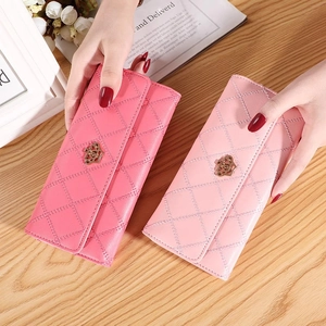 Classic quilted long wallet for women with golden crown ornament in pink and rose tones