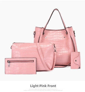 Detail of light pink 4-piece handbag set with crocodile pattern, tote and crossbody bags