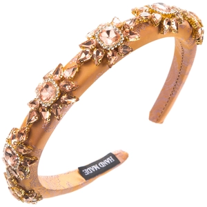 Detail of handmade champagne satin headband with purple paisley embroidery and peach crystals