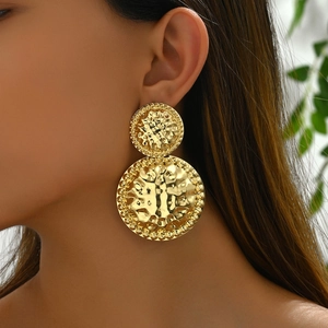 Elegant gold double circle hammered drop earrings worn by a model for a chic luxury look