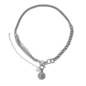 Silver layered necklace with Cuban chain, pearl pendant, and religious medal on white background