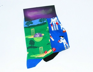 Detailed top view of mismatched cotton socks with cricket players and goal patterns