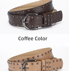 Close-up of vintage punk leather belts featuring three rows of metal rivets and buckles