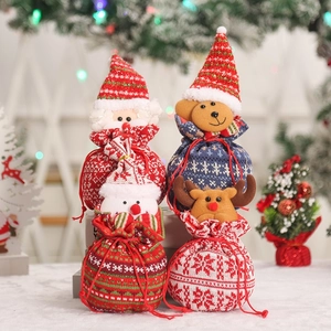 Set of four knitted Christmas drawstring gift bags with 3D Santa, deer, and snowman motifs