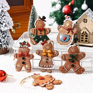 Set of resin gingerbread man ornaments with colorful details for Christmas tree decoration
