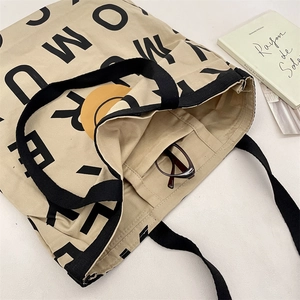 Macro shot of thick canvas tote interior with inner pocket and spacious capacity