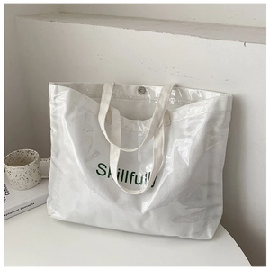 Detail of transparent PVC tote bag with canvas inner and Skillfully text print