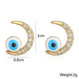 Detail of crescent moon evil eye earrings with dimensions 1cm by 0.8cm and weight 2g