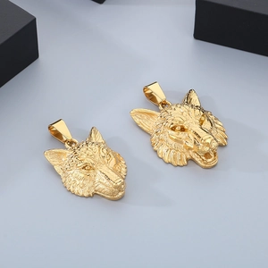 Macro view of detailed golden wolf head pendants in punk viking style with metallic luster