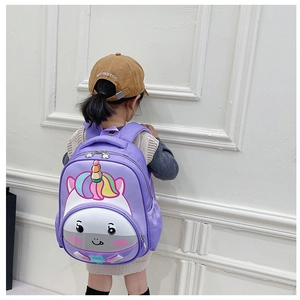 Toddler purple backpack with 3D unicorn design shown on child model back view