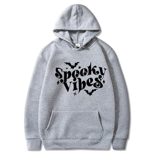 Detail of grey hoodie with Spooky Vibes text and bat print plus M size label