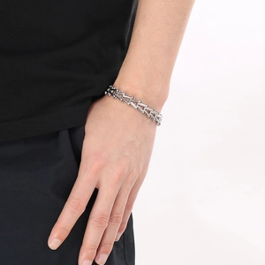 Sleek silver stainless steel interlocking link bracelet for men in minimalist industrial style