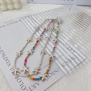 Bohemian colorful and white beaded necklace set with starfish pendants for beach style