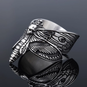 Macro detail of gothic stainless steel death moth ring with vintage silver finish