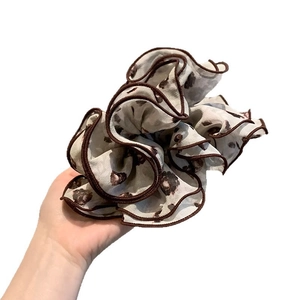 Elegant oversized chiffon scrunchie with brown leopard print and dark wavy piping edge