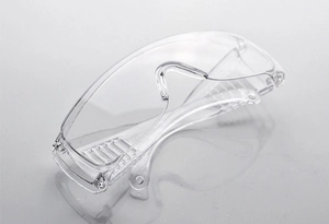 Detail of clear protective safety goggles featuring anti-fog side ventilation slots