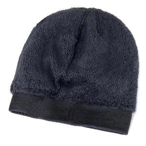 Detailed texture of dark gray winter knit beanie with warm fleece and soft ribbed brim