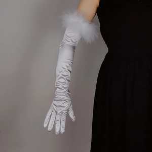 Detail of white satin opera gloves featuring elegant feather trim on the wrist area