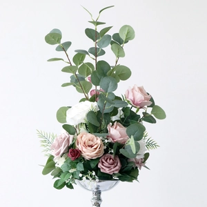 Elegant artificial rose flower arrangement with eucalyptus in a silver metal tall vase