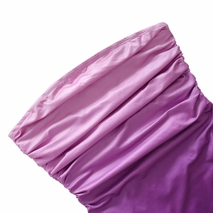 Detail of purple gradient strapless dress featuring ruched satin fabric and pleated texture