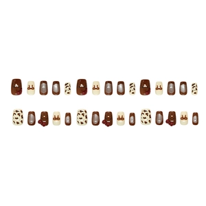Caramel cat eye press-on nails with leopard print and cute cartoon bow designs
