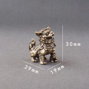 Miniature brass lion statue with traditional carvings, 30mm height antique desk ornament