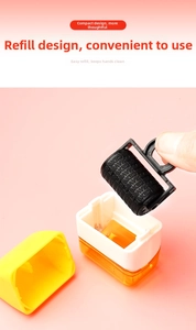 Close-up of a privacy roller stamp featuring a replaceable black core and yellow cover