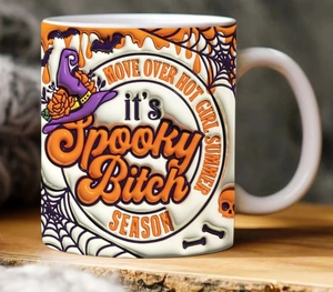 Macro detail of 3D Spooky Bitch Season pumpkin Halloween ceramic mug with embossed texture