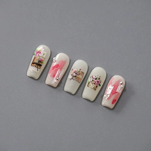 Floral embossed press-on nails with cream and pink flower patterns and tiny pearls