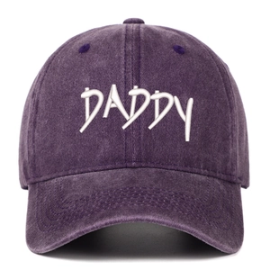Close-up of white DADDY embroidery on vintage washed purple cotton baseball cap