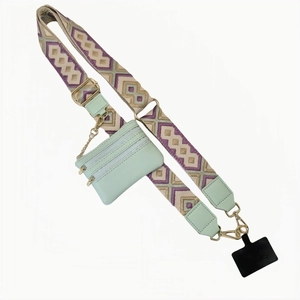 Crossbody phone strap with mint green coin purse and geometric woven shoulder band
