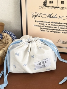 White cotton tissue holder bag with blue bow prints and drawstring for home decor