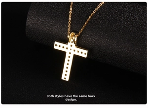 Macro shot of gold cross pendant with intricate mesh hollow-out back detailing